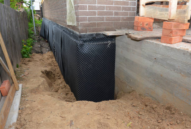 Happy homeowners after waterproofing job in Williamson